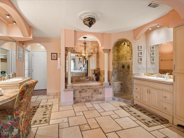 full bathroom with visible vents, a garden tub, a sink, and a tile shower