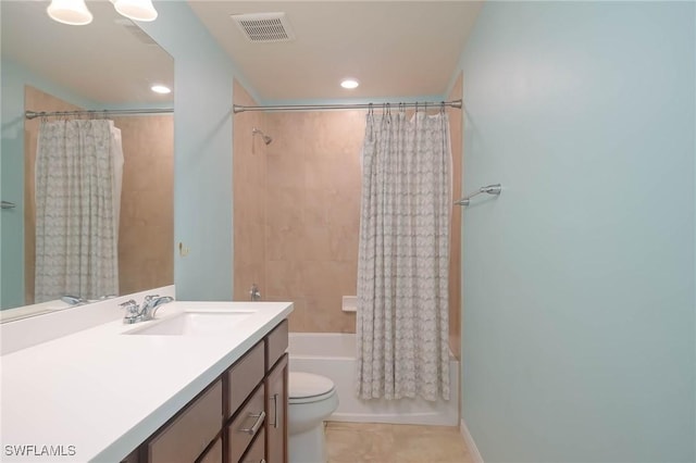 full bathroom with shower / tub combo with curtain, vanity, tile patterned flooring, and toilet