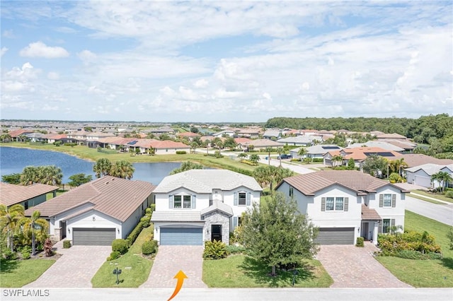 birds eye view of property with a water view