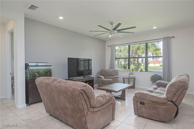 tiled living room with ceiling fan