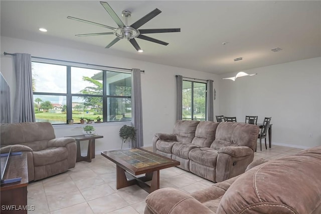 tiled living room featuring ceiling fan