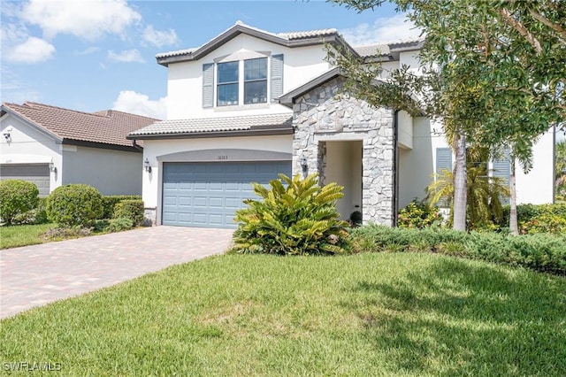 view of front of house with a garage and a front yard