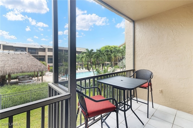 balcony featuring a community pool