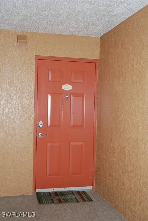 doorway to property with stucco siding