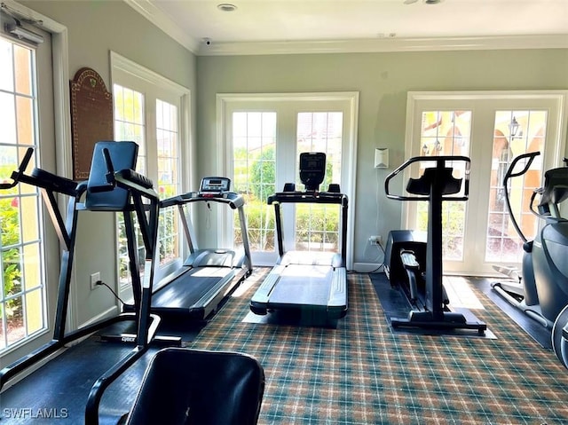 workout room featuring crown molding