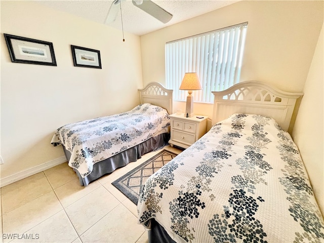 bedroom featuring ceiling fan and light tile patterned floors