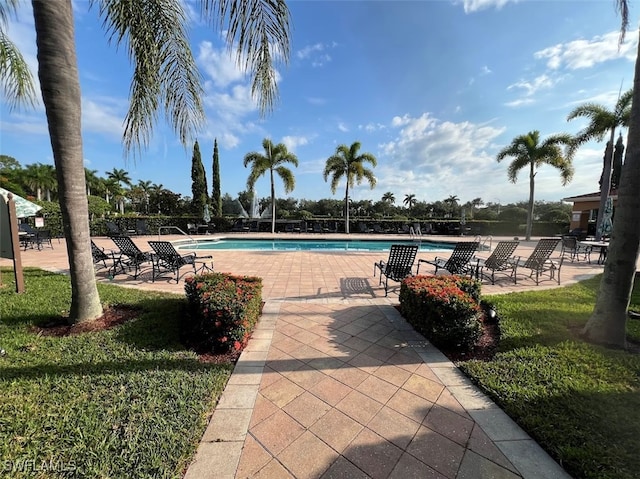 view of swimming pool featuring a patio area