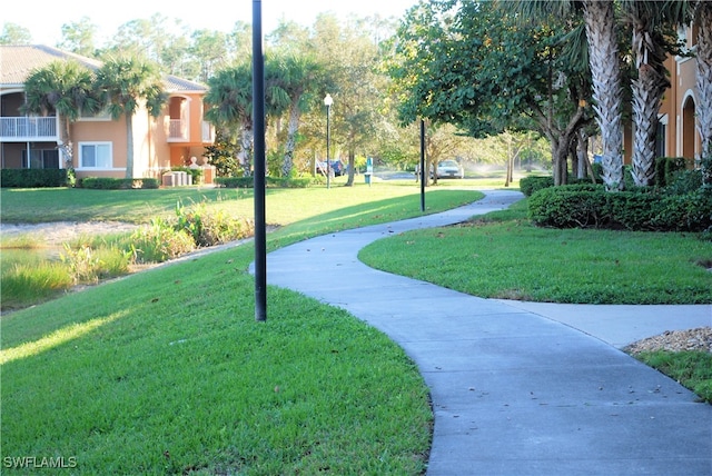 view of home's community with a lawn