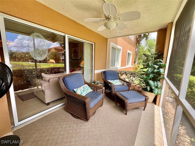 sunroom / solarium with ceiling fan