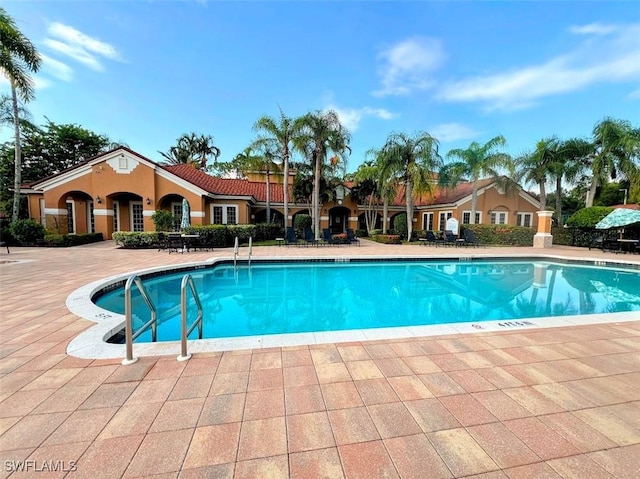 pool with a patio area