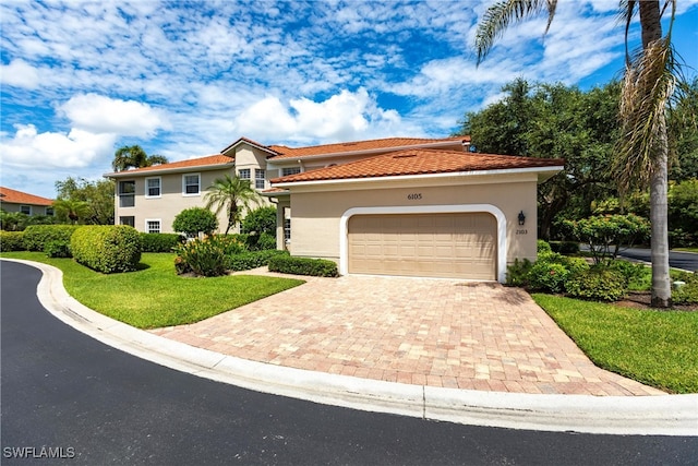 mediterranean / spanish-style home featuring a garage