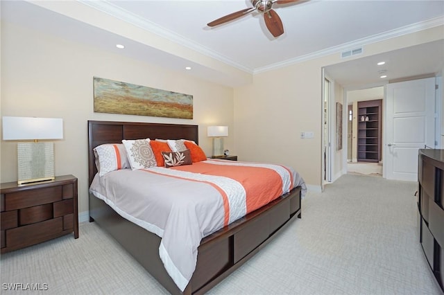 carpeted bedroom featuring ceiling fan and ornamental molding