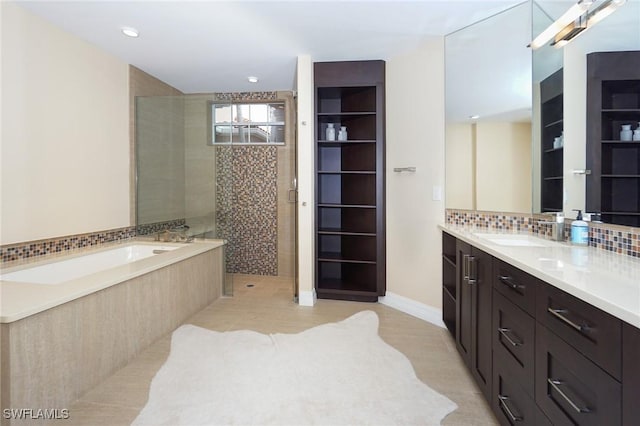 bathroom with separate shower and tub, vanity, decorative backsplash, and tile patterned flooring