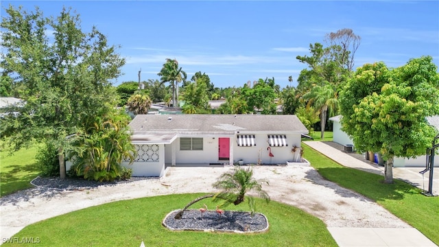 ranch-style home with a front yard