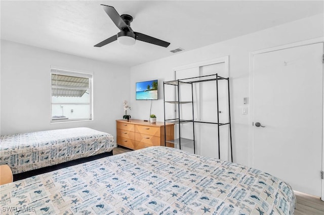 bedroom featuring hardwood / wood-style floors and ceiling fan