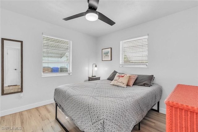 bedroom featuring ceiling fan and hardwood / wood-style floors