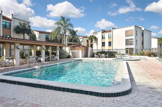 view of swimming pool with a patio