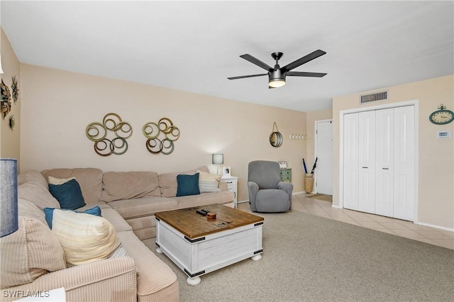 living room featuring ceiling fan and light colored carpet