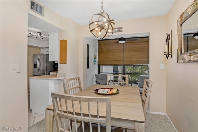 dining space with a chandelier