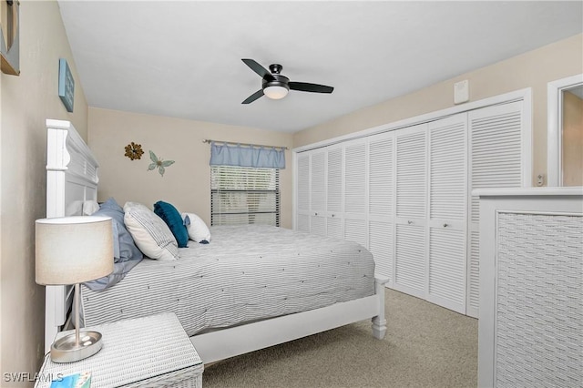 bedroom featuring ceiling fan, a closet, and carpet