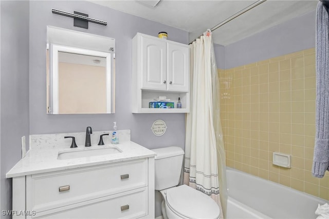 full bathroom featuring shower / tub combo with curtain, vanity, and toilet