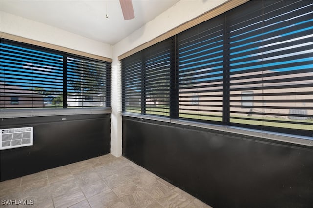 interior space with tile patterned flooring and ceiling fan