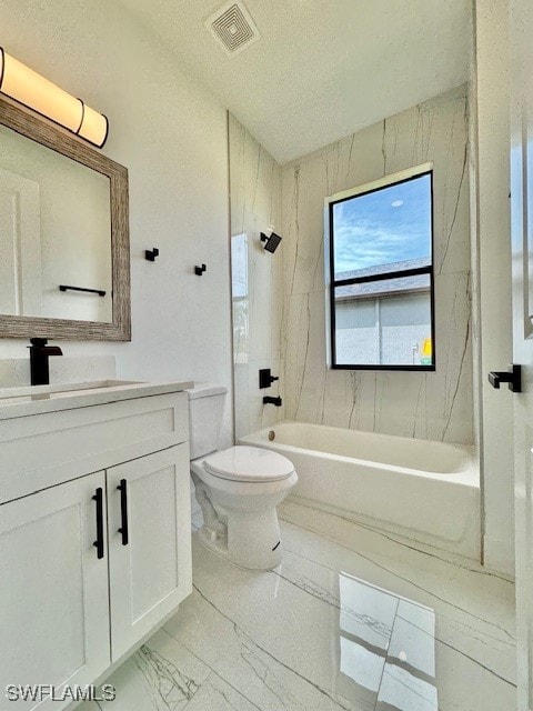 full bathroom featuring vanity, toilet, and tiled shower / bath combo