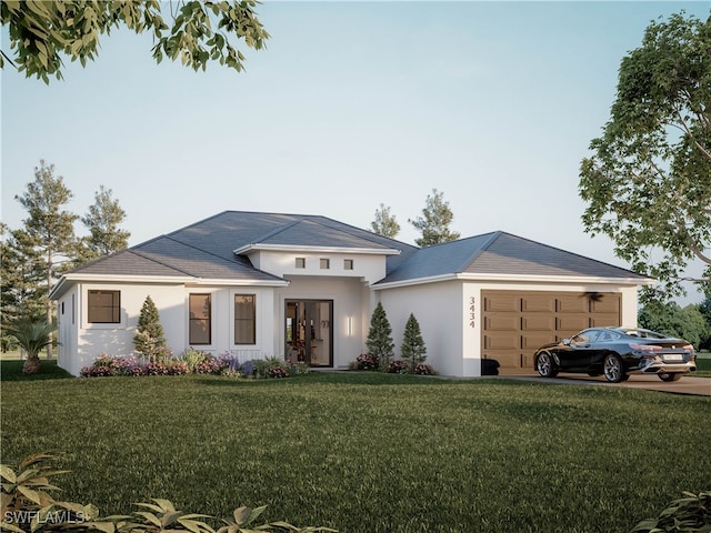 view of front of property featuring a garage and a front lawn