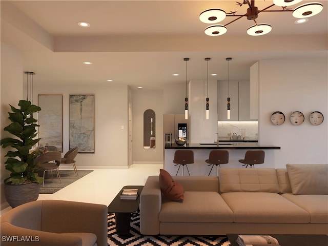 living room featuring a notable chandelier