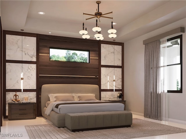 bedroom featuring light tile patterned floors and a tray ceiling