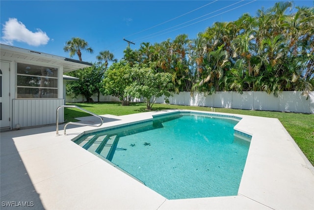 view of pool featuring a yard and a patio area