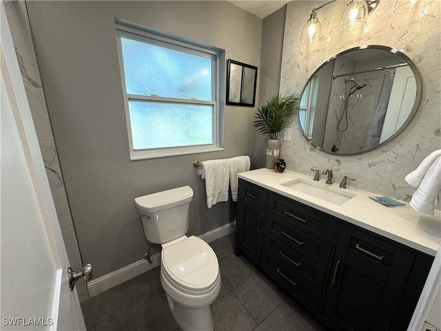 bathroom featuring a shower with curtain, tile patterned flooring, vanity, and toilet