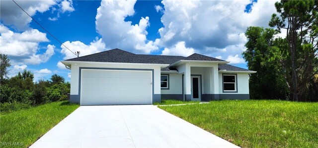 view of front facade with a front lawn and a garage