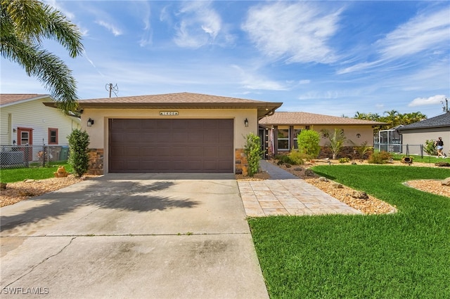 ranch-style home featuring an attached garage, fence, and stone siding