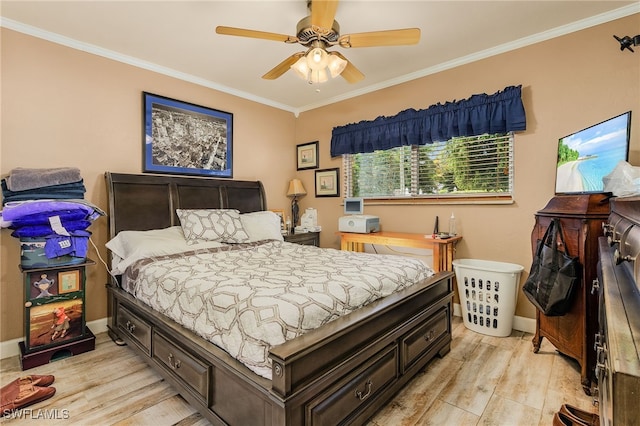 bedroom with ceiling fan, baseboards, light wood-style flooring, and crown molding