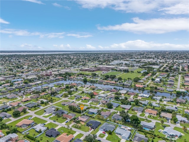 bird's eye view featuring a residential view and a water view