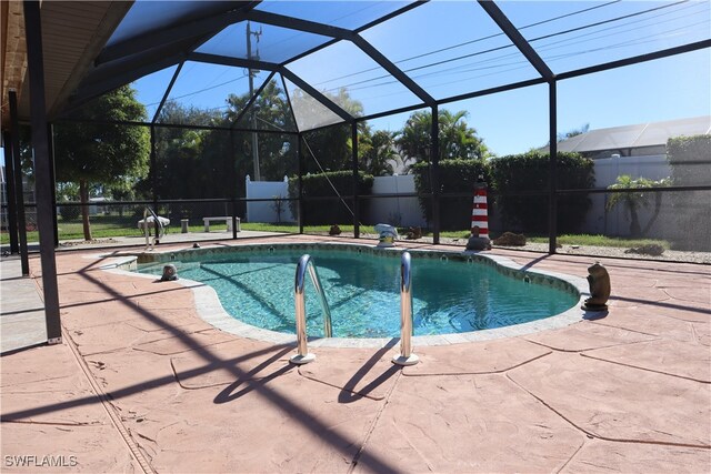 view of pool with a patio area, a fenced in pool, a lanai, and a fenced backyard