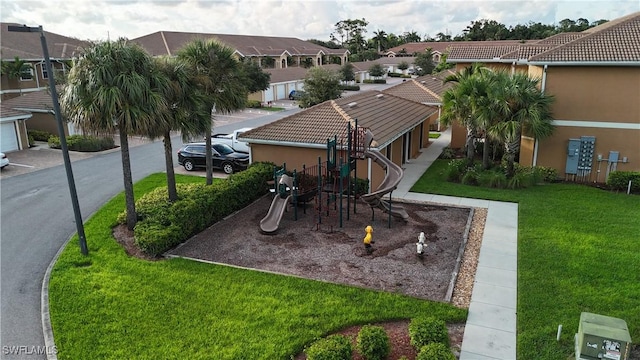 exterior space featuring a residential view and a yard