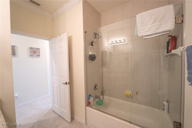 bathroom featuring tile patterned flooring, shower / bath combination with glass door, and ornamental molding