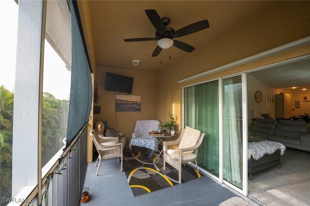 sunroom / solarium with ceiling fan