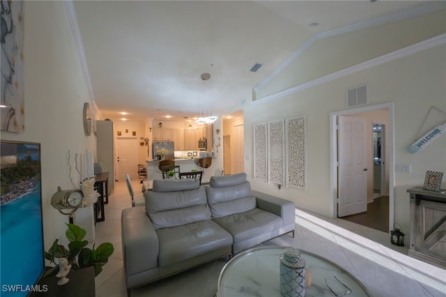 living room with tile patterned floors, vaulted ceiling, and ornamental molding