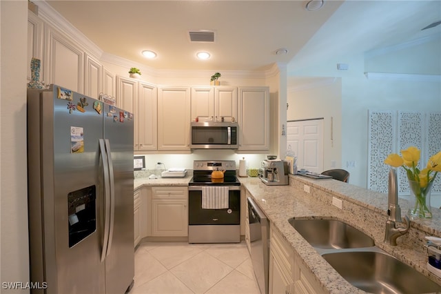 kitchen with crown molding, light tile patterned floors, light stone counters, stainless steel appliances, and sink