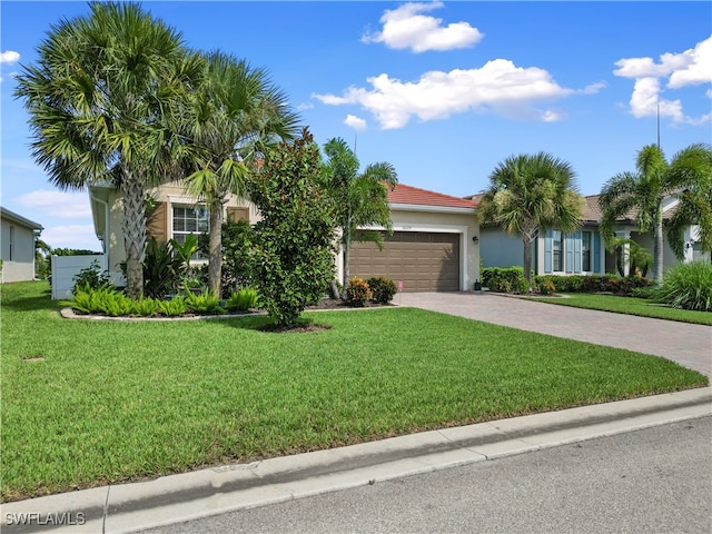 view of front of home featuring a garage and a front yard