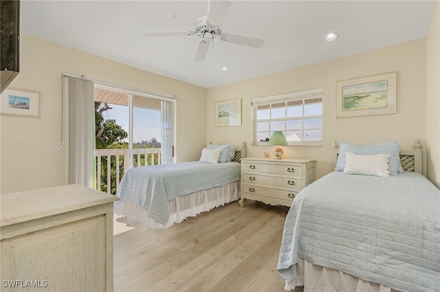 bedroom with ceiling fan, access to outside, light hardwood / wood-style flooring, and multiple windows