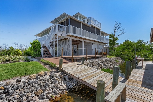 rear view of house with a wooden deck