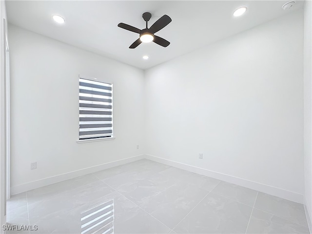 unfurnished room featuring ceiling fan and tile patterned flooring