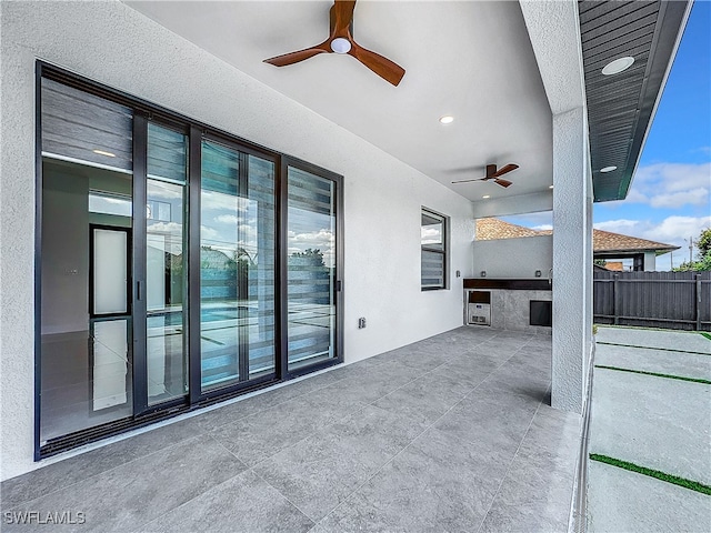 view of patio featuring ceiling fan