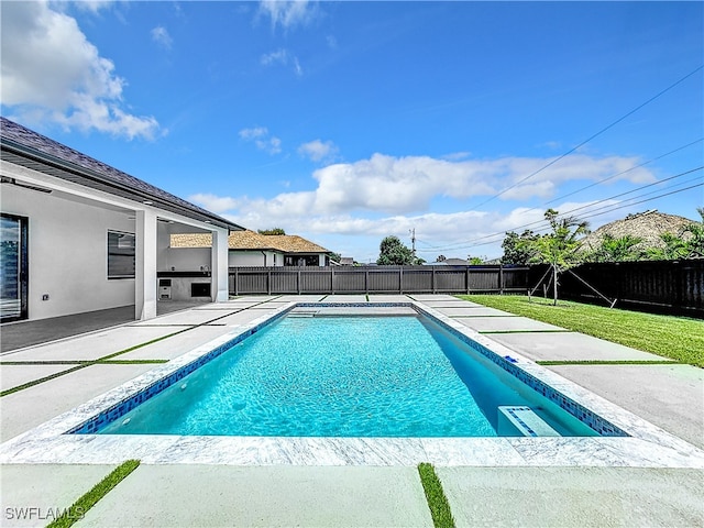 view of pool featuring a yard and a patio