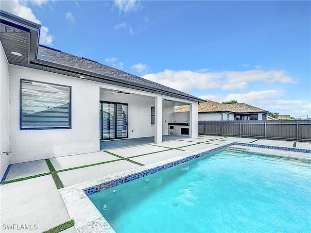 view of pool featuring ceiling fan and a patio