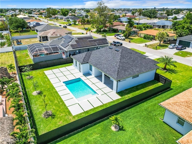 view of swimming pool featuring a patio area and a yard